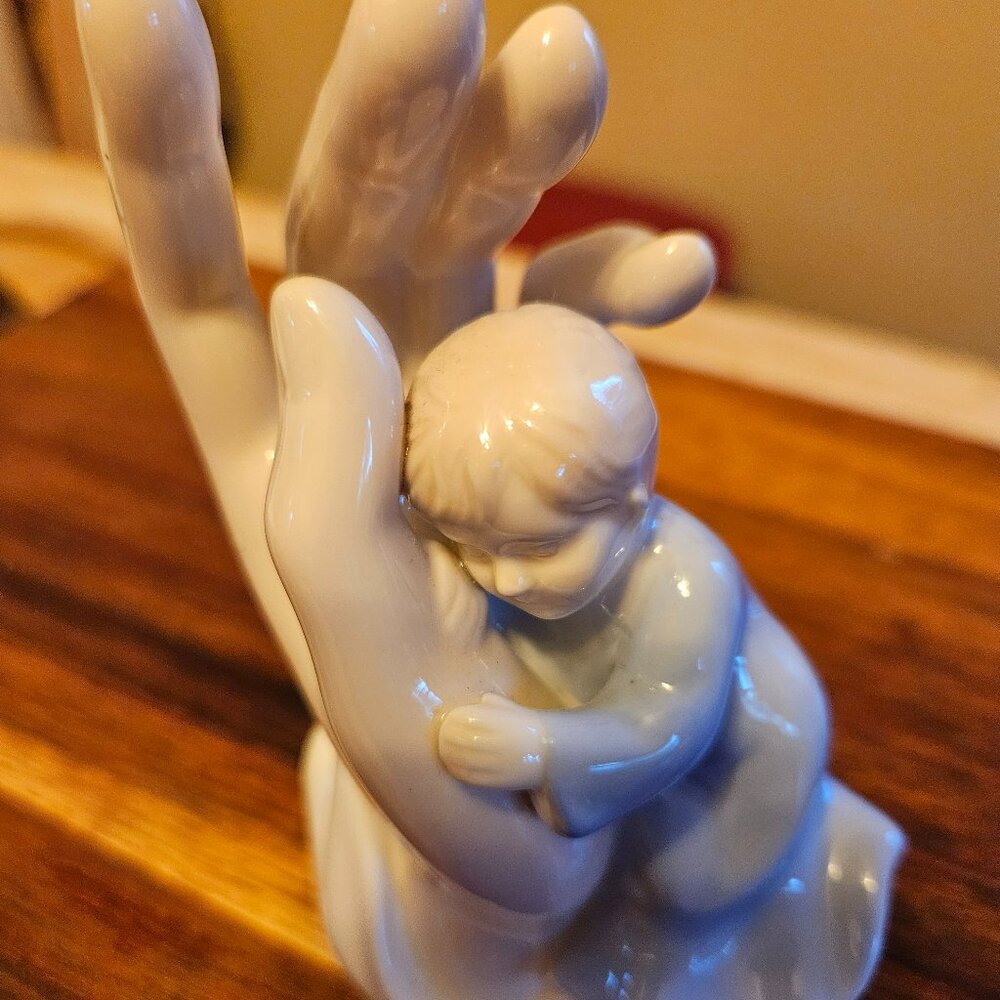 porcelain child in palm of hand figurine in blue 2004